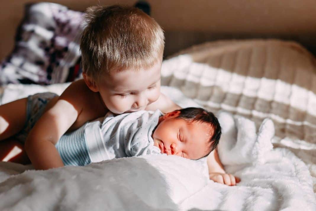 Newborn baby and toddler siblings