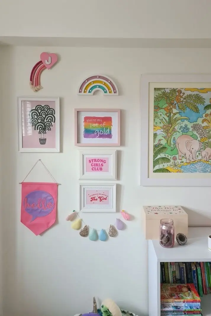 Girls' bedroom wall gallery featuring pastel pink and rainbow colours 