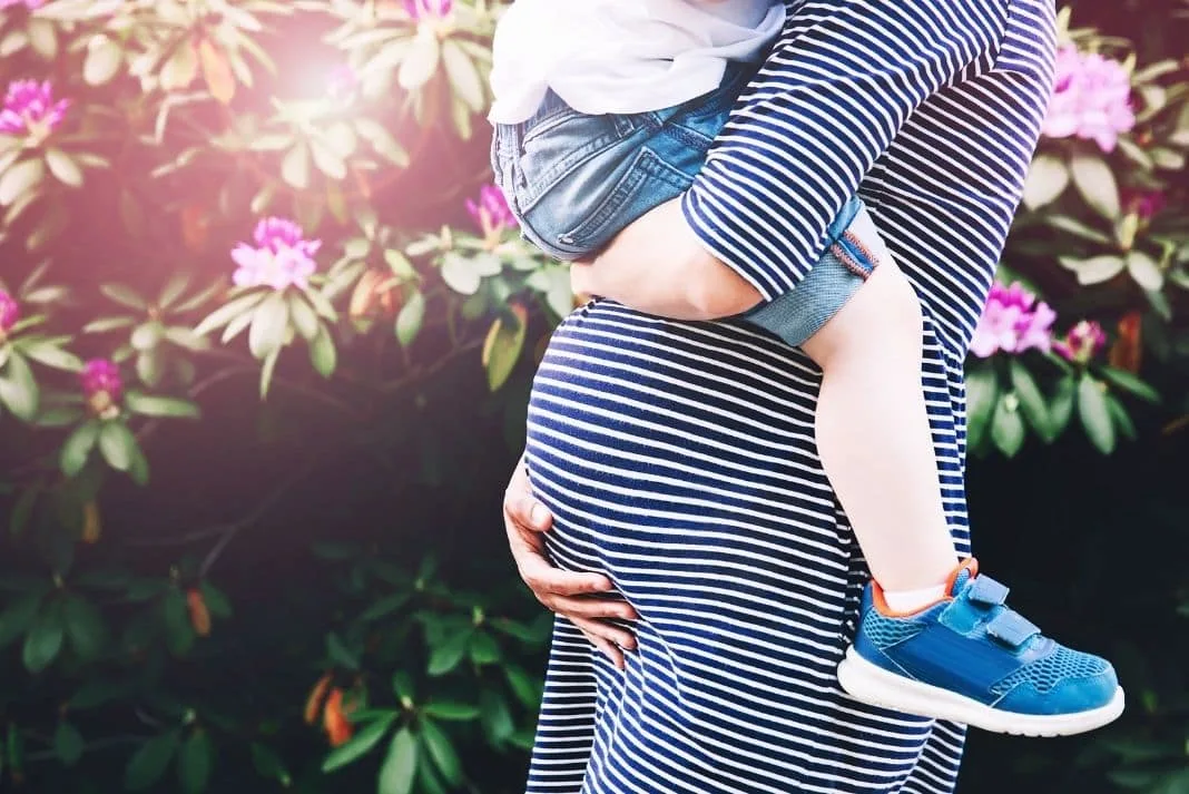 Pregnant mum with a child preparing for second baby