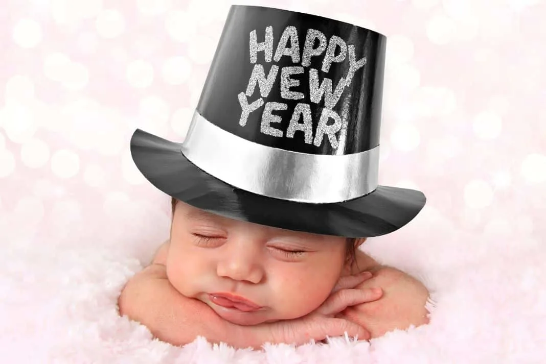 Baby wearing a party Happy New Year's Eve hat
