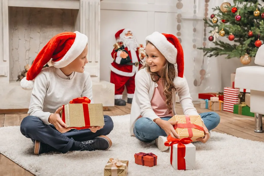 Kids opening Christmas gifts